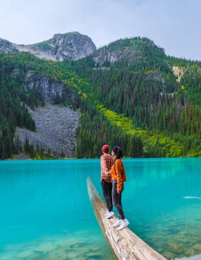 Joffre Lakes British Colombia Whistler Canada, colorful lake of Joffre lakes national park in Canada. Couple of Asian women and caucasian men walking at Jofre Lake BC Canada