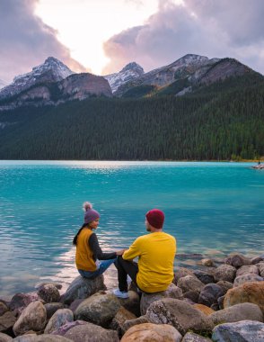 Lake Louise Canadian Rockies Banff national park, Beautiful autumn views Lake Louise in Banff National Park in the Rocky Mountains of Alberta Canada. young couple men and women visiting Lake Louise