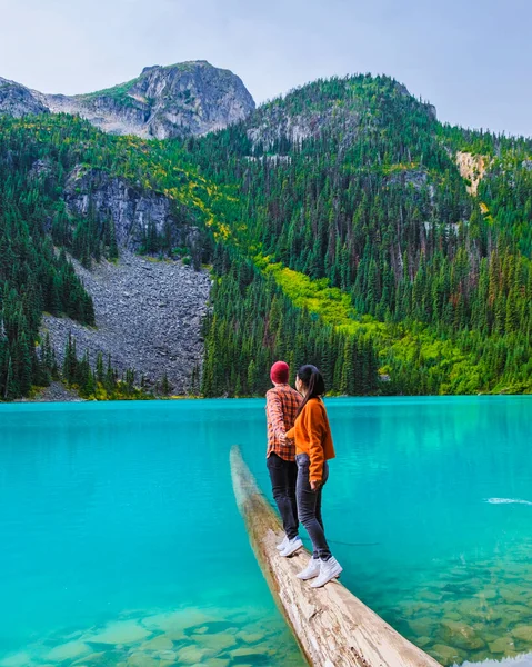 Joffre Lakes British Colombia Whistler Canada, colorful lake of Joffre lakes national park in Canada. Couple of Asian women and caucasian men walking at Jofre Lake BC Canada