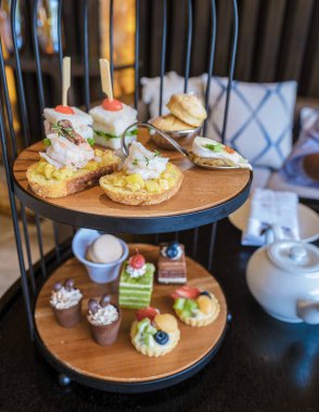 Luxury high tea with snacks and tea in a luxury hotel