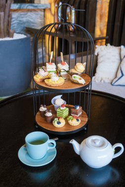 Luxury high tea with snacks and tea in a luxury hotel