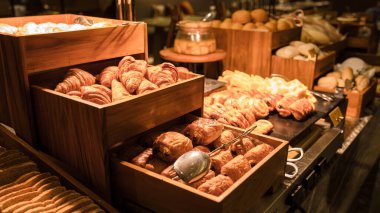 Breakfast buffet in a luxury hotel. bread corner with croissant muffin and chocolate bread at the bread buffet