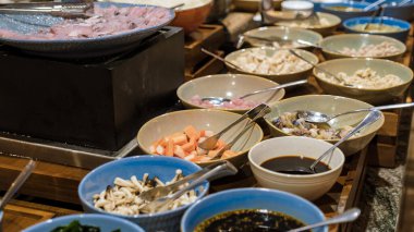 Breakfast buffet in a luxury hotel. Japanese corner with sushi and noodle soup