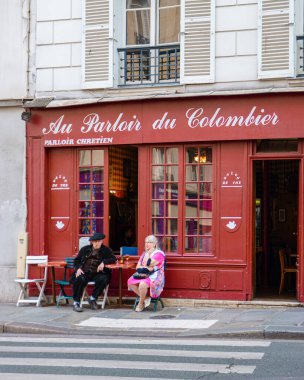 Paris France September 2021, people drinking coffee on the terrace of a cafe restaurant during the Autumn end of summer. 