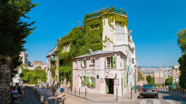 Paris France September 2021, Streets of Montmartre in the early morning with cafes and restaurants, and colorful street views. La Maison Rose cafe restaurant at Montmarte. 