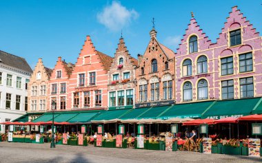 Brugge Belgium September 2021, a colorful house in the old city of Brugge with restaurants at the square. 