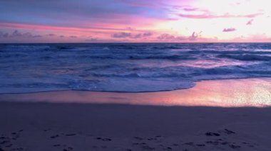 Sunset on a Beach at the tropical island Koh Lanta Krabi Thailand. orange and pink colors during sunset on the beach
