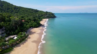 Drone aerial view on a Beach with beach chairs and umbrella at the tropical island Koh Lanta Krabi Thailand