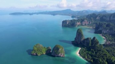 Railay Beach Krabi Thailand, the tropical beach of Railay Krabi, panoramic view of idyllic Railay Beach in Thailand with huge limestone rocks 