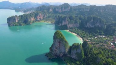 Railay Beach Krabi Thailand, the tropical beach of Railay Krabi, panoramic view of idyllic Railay Beach in Thailand with huge limestone rocks 