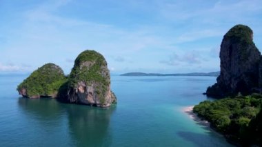 Railay Beach Krabi Thailand, the tropical beach of Railay Krabi, panoramic view of idyllic Railay Beach in Thailand with huge limestone rocks 