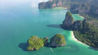 Railay Beach Krabi Thailand, the tropical beach of Railay Krabi, panoramic view of idyllic Railay Beach in Thailand with huge limestone rocks 