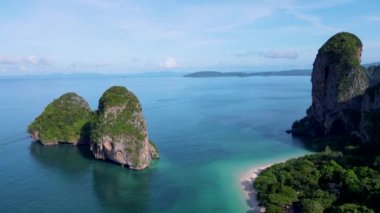 Railay Beach Krabi Thailand, the tropical beach of Railay Krabi, panoramic view of idyllic Railay Beach in Thailand with huge limestone rocks 