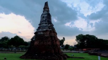 High water at the river in Ayutthaya, Thailand at Wat Chaiwatthanaram during sunset in Ayutthaya Thailand during the monsoon rain season,high water protection wall by river