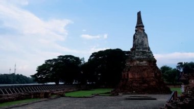 High water at the river in Ayutthaya, Thailand at Wat Chaiwatthanaram during sunset in Ayutthaya Thailand during the monsoon rain season,high water protection wall by river