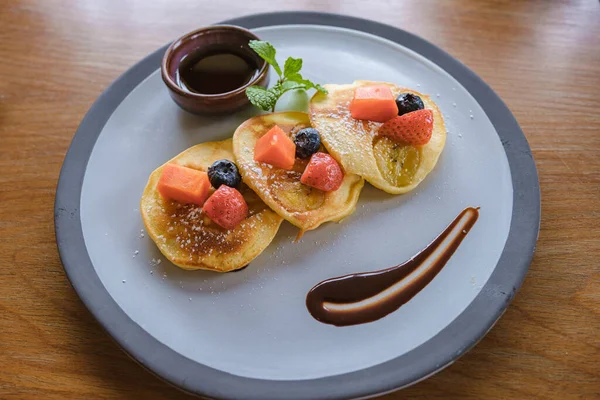 Top view of pancakes with fruit, Luxury breakfast in the morning on a table, top view of breakfast in a luxury restaurant in Thailand