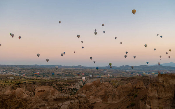 Sunrise with hot air balloons in Cappadocia, Turkey balloons in Cappadocia Goreme Kapadokya, and Sunrise in the mountains of Cappadocia with many hot air ballon in the sky