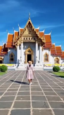 Wat Benchamabophit temple in Bangkok Thailand, The Marble temple in Bangkok Thailand, couple men and women visiting the Marble temple in Bangkok