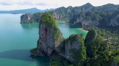 Railay Beach Krabi Thailand, the tropical beach of Railay Krabi, panoramic view of idyllic Railay Beach in Thailand with huge limestone rocks 
