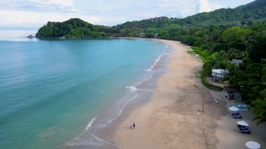 Drone aerial view on a Beach with beach chairs and umbrella at the tropical island Koh Lanta Krabi Thailand