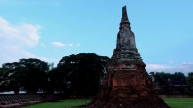 High water at the river in Ayutthaya, Thailand at Wat Chaiwatthanaram during sunset in Ayutthaya Thailand during the monsoon rain season,high water protection wall by river