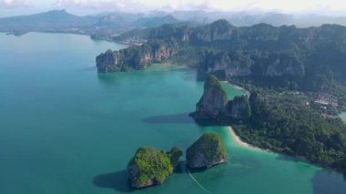 Railay Beach Krabi Thailand, the tropical beach of Railay Krabi, panoramic view of idyllic Railay Beach in Thailand with huge limestone rocks 