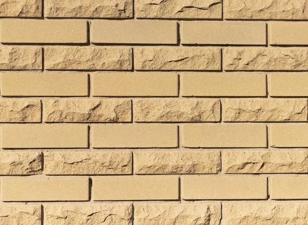 Wall of yellow stone. Background and texture — Stockfoto