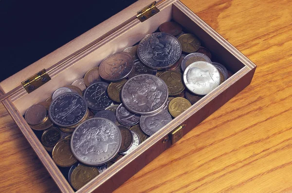 Box with old US coins inside Stock Photo