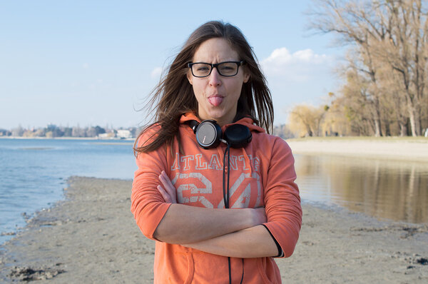 Young Happy Woman Sticking Out Her Tongue