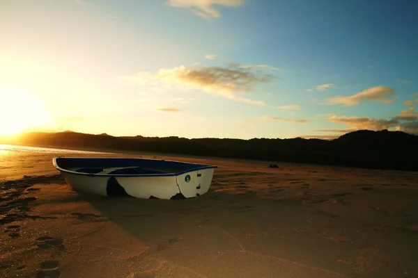 Boat on the beach Stock Photo