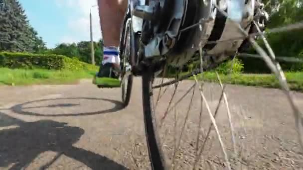 Cyclist Pedals Bike Low Angle View Shot — Vídeo de Stock