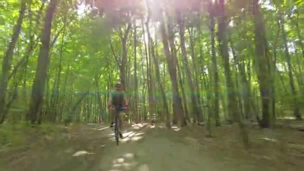 Young Man Bicycle Helmet Rides Bicycle Forest Shot — Stock video