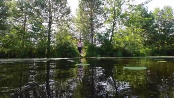 Woman Fishing Shore Lake Sunny Day — Vídeo de Stock