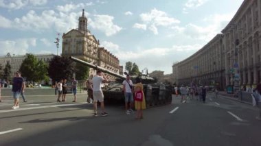 Kyiv, Ukraine - August 24, 2022: Independence Day on Kiev's central street Khreshchatyk. People inspect Russian equipment on display for a symbolic parade of the Russian army in Ukraine. 