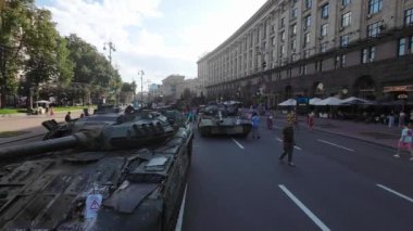 Kyiv, Ukraine - August 24, 2022: Evidence of Russian military aggression against Ukraine - burned and destroyed Russian military equipment on Kreshchatik in Kiev. People look at and take pictures of Russian equipment destroyed in Ukraine. 