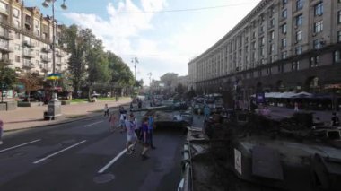 Kyiv, Ukraine - August 24, 2022: Parade of Russian military equipment destroyed in Ukraine on Kreshchatik Street on Ukraine's Independence Day. People look at and take pictures of Russian equipment destroyed in Ukraine. 
