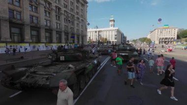 Kyiv, Ukraine - August 24, 2022: Independence Day on Kiev's central street Khreshchatyk. People inspect Russian equipment on display for a symbolic parade of the Russian army in Ukraine. 