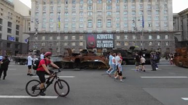 Kyiv, Ukraine - August 24, 2022: Evidence of Russian military aggression against Ukraine - burned and destroyed Russian military equipment on Kreshchatik in Kiev. People look at and take pictures of Russian equipment destroyed in Ukraine. 