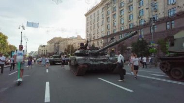 Kyiv, Ukraine - August 24, 2022: Parade of Russian military equipment destroyed in Ukraine on Kreshchatik Street on Ukraine's Independence Day. People look at and take pictures of Russian equipment destroyed in Ukraine. 