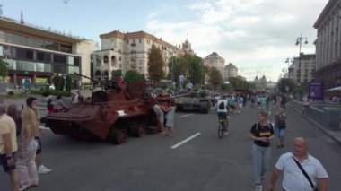 Kyiv, Ukraine - August 24, 2022: Evidence of Russian military aggression against Ukraine - burned and destroyed Russian military equipment on Kreshchatik in Kiev. People look at and take pictures of Russian equipment destroyed in Ukraine. 