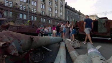 Kyiv, Ukraine - August 24, 2022: Evidence of Russian military aggression against Ukraine - burned and destroyed Russian military equipment on Kreshchatik in Kiev. People look at and take pictures of Russian equipment destroyed in Ukraine. 