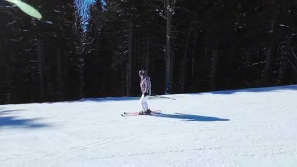 Woman Skiing Ski Slope Sunny Day Tracking Shot — Stock Video