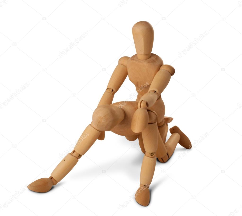 Wooden figures with kama sutra positions, isolated on white