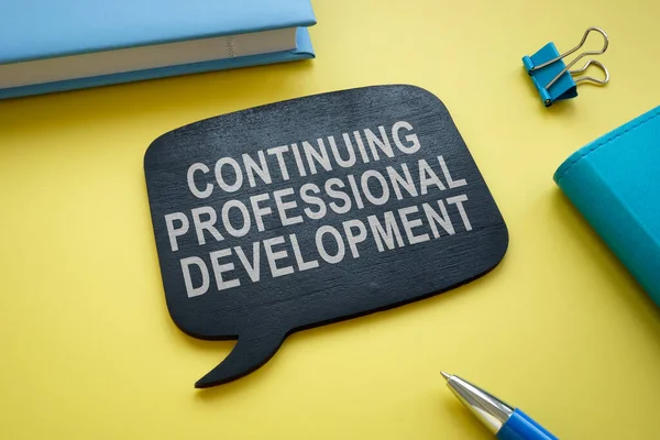 Continuing professional development memo on the yellow desk. — Stock Photo, Image