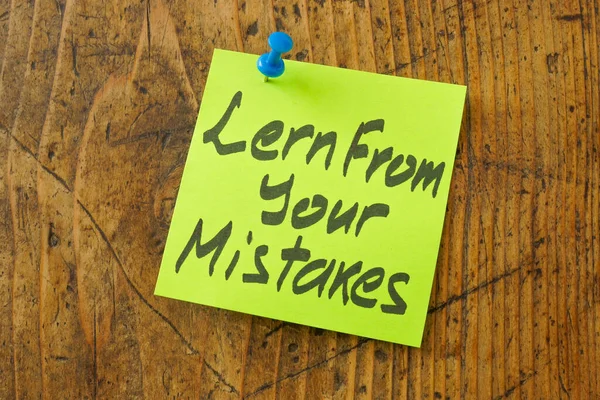 Learn from your mistakes inscription on the sticker. — Stock Photo, Image