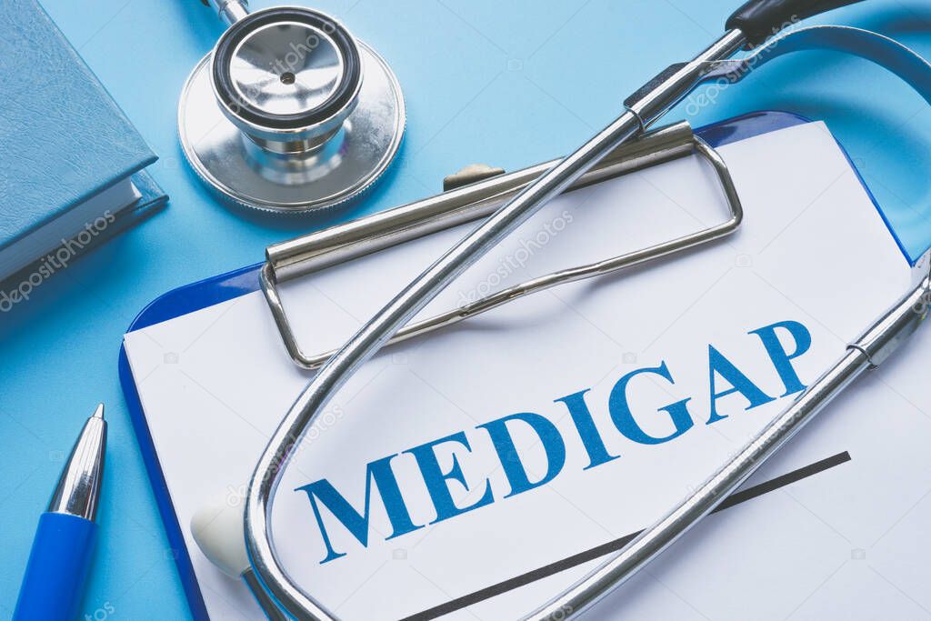 Medicare Supplement Insurance Medigap application and stethoscope.