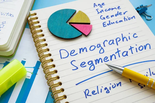 Demographic segmentation list on the page and papers. — Stock Photo, Image