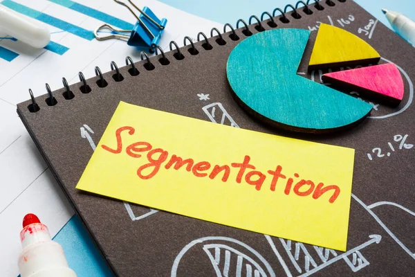 Papers with charts and graphs and Segmentation memo on it. — Stock Photo, Image