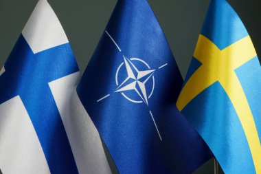 KYIV, UKRAINE - May 7, 2022. Flags of Sweden, Finland and NATO.