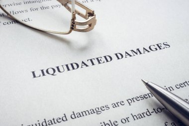 Documents about Liquidated damages with pen and glasses. clipart
